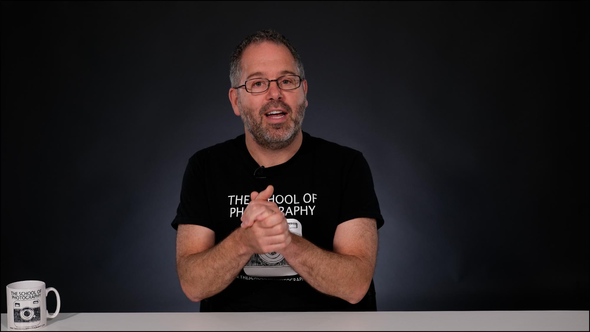 Marc at desk presenting