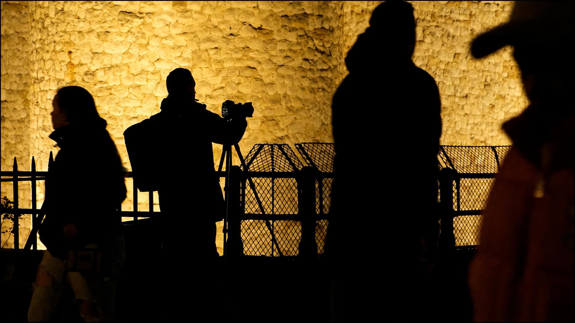 Silhouette of photographer and other people