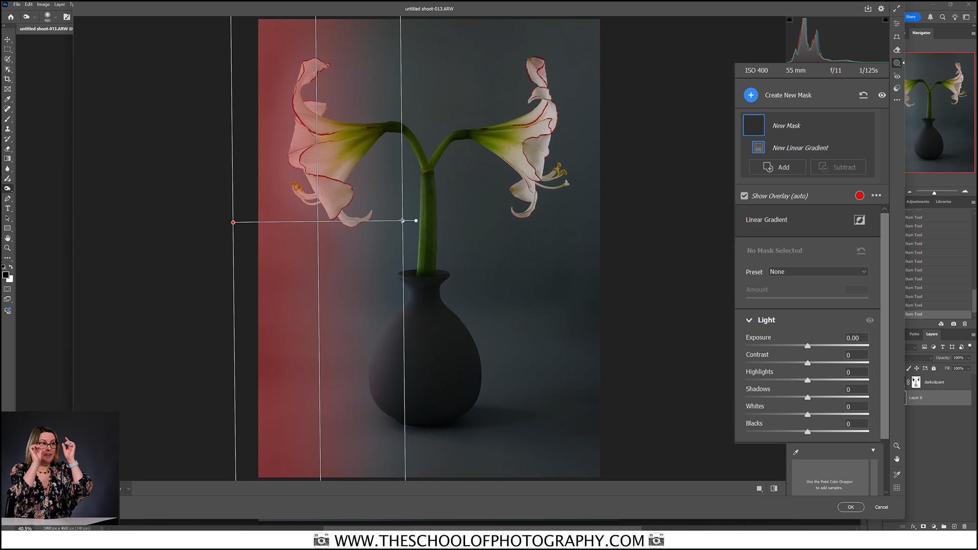 Woman teaching photo editing software with a vase of white amaryllis flowers on screen, showing masking tools.