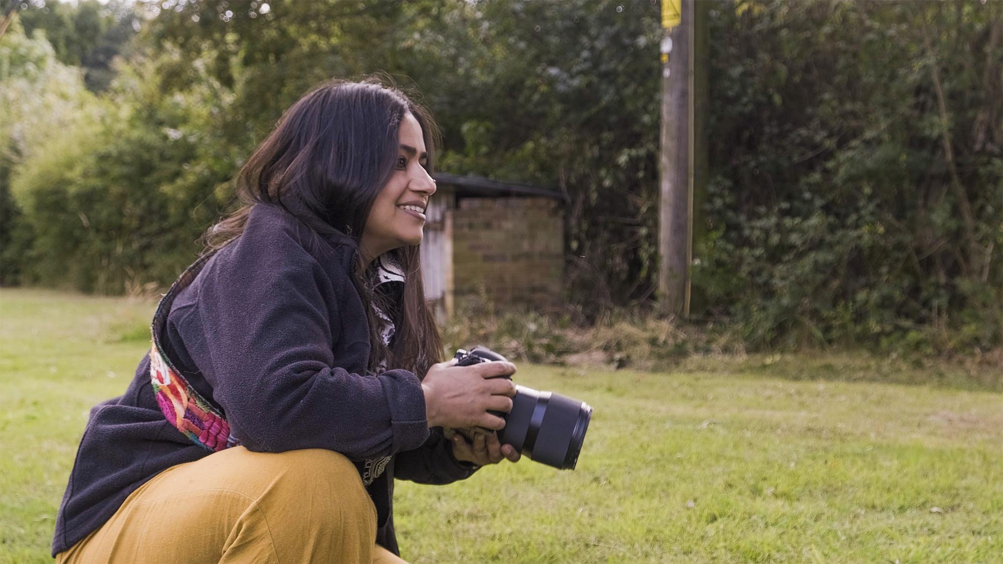 Portrait of Sujata Setia holding a picture